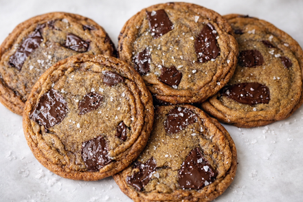 Stack of chocolate chip cookies on a light background